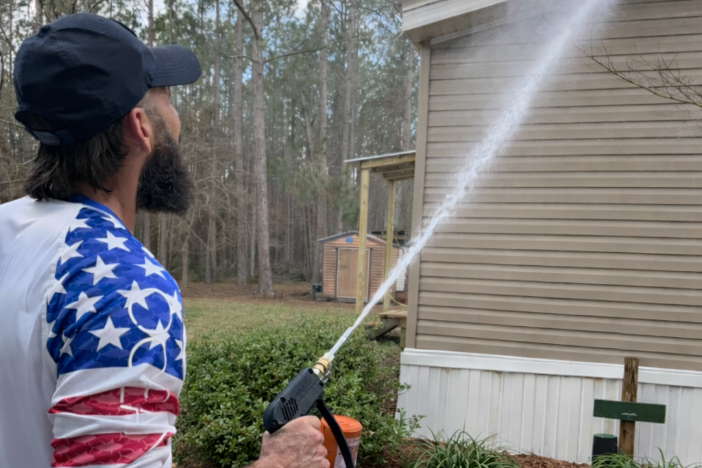 Butler Exterior soft washing a house in Statesboro, GA